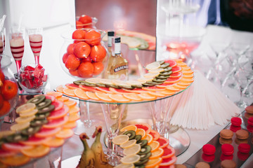 Various sweet sliced fruit on a buffet table