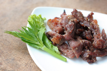 Roast pork with sesame on plate