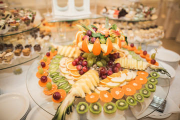 Various sweet sliced fruit on a buffet table