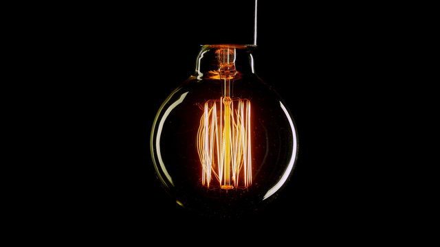 Real Edison light bulb flickering. Vintage filament Edison light bulb.  4K UHD.
