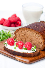 Traditional  black rye bread with raspberries and thyme and soft