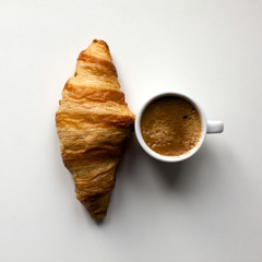 Croissant and espresso on white background