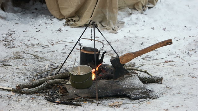 On the fire to cook the porridge and tea