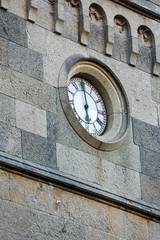 antique clock on a stone tower