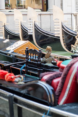 Fototapeta na wymiar Gondolas in a water Channel in Venice 
