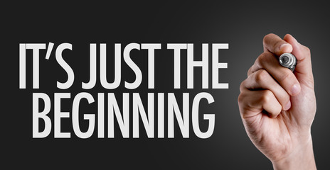 Hand writing the text: Its Just the Beginning