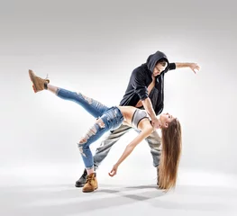 Gordijnen Acrobat pose of a two talented dancers © konradbak