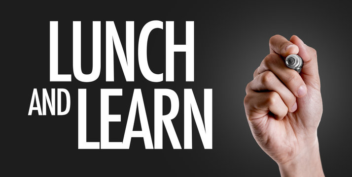 Hand writing the text: Lunch and Learn