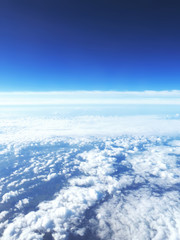 Sky background with clouds and copy space. Sky scene, view outside of an airplane window.  