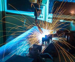 Welding robots movement in a car factory