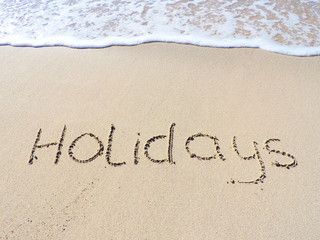 Holidays, drawing in the sand