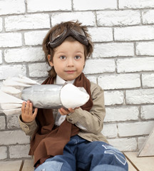 boy with rocket indoors play