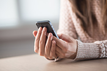 Woman holding credit card while using computer