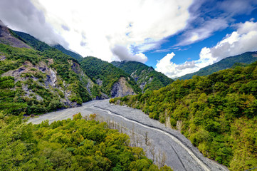 Fototapeta na wymiar Beautiful river, trees, mountains in Hsin Chu rural area