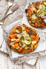 Vegetarian pizza with addition of bell pepper, zucchini, onion and herbs