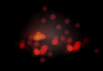 A charcoal fire is blurred with the effect of stained glass