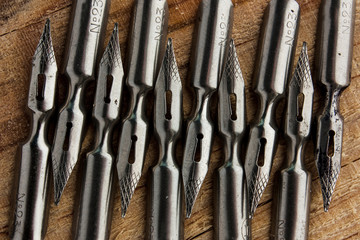 Pens on a wooden background