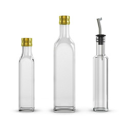 empty glass bottles for olive oil of different sizes isolated on