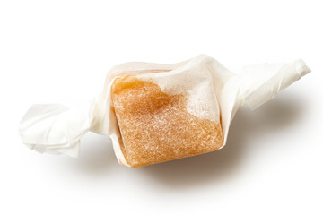 SIngle luxury wrapped caramel toffee isolated from above.