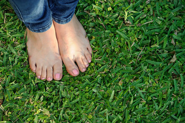 bare foot on green grass