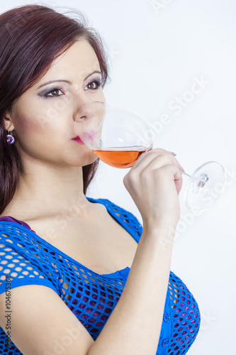 portrait of young woman drinking rose wine