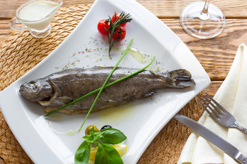 the  boiled rainbow trout with fresh vegetables 