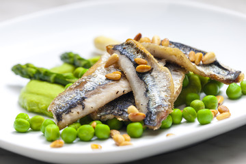 herring with green asparagus and peas