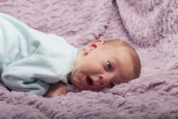 Adorable newborn baby with funny face