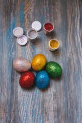 Easter eggs on wooden table. Holiday background