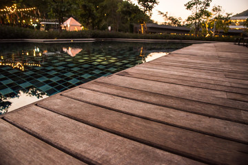 wooden pool terrace in evening time