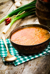 Vegetable stew. Delicious soup with vegetables and spices on wood.
