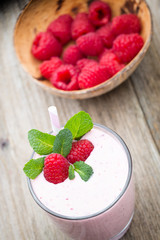 Raspberry milk shake with mint decor.