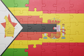 puzzle with the national flag of spain and zimbabwe