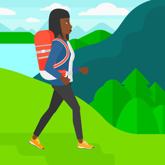 Woman with backpack hiking.