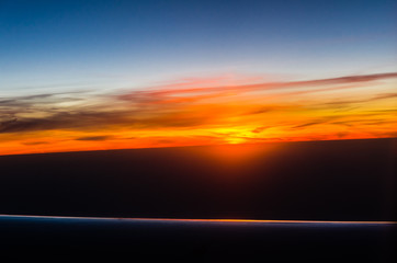 Obraz premium Sunset view from airplane