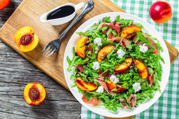 peaches, arugula, prosciutto and goat cheese salad with balsamic