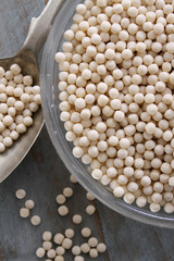 healthy uncooked giant couscous in dish