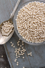 healthy uncooked giant couscous in dish