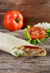 chicken wrap in tortilla with sauce
