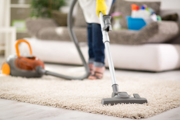 Vacuuming carpet