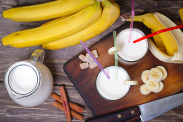 Fresh made Banana smoothie on wooden background