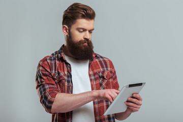 Bearded man with gadget