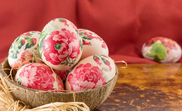 Decorated Easter eggs in a coconut shell
