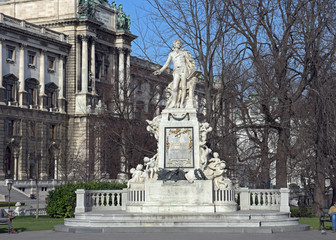 Mozart Statue and Museum of Ethnology in Burggarten. Vienna, Austria.