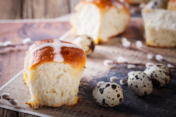 Easter Hot Cross Buns on wooden background.selective focus.