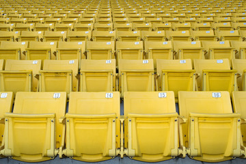 Fototapeta premium Yellow stadium seats on the stadium sport