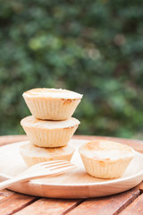 Mini pies on wooden plate