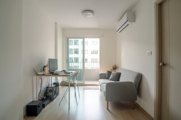 Living room with working area in apartment