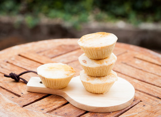 Mini pies on wooden plate