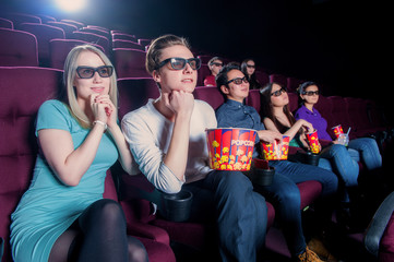 Obraz premium People in the cinema wearing 3d glasses